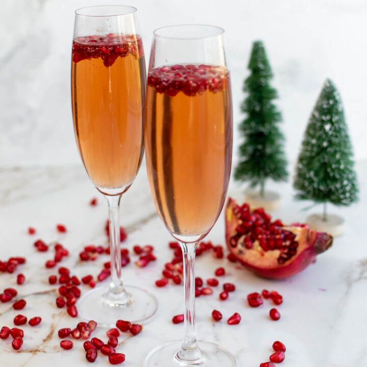 Pomegranate Poinsettia Cocktail with pomegranate arils for garnish.