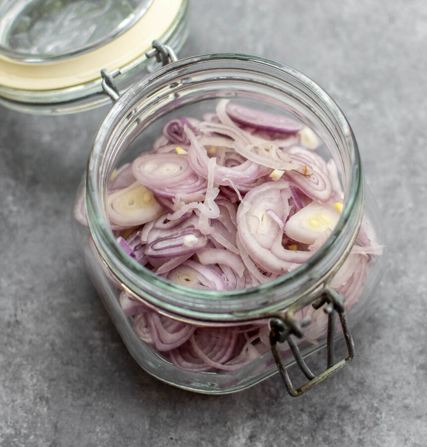 Sliced shallots in a jar. 
