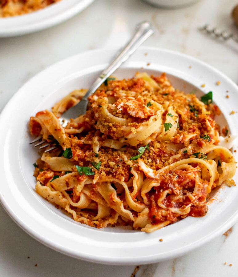 Pasta with Spicy Crab Sauce in a bowl. Topped with fried breadcrumbs.